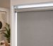 Close-up view of a modern grey roller blind installed near Dragon Mart Dubai by HomeDecor UAE.