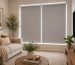 Modern roller blinds near me installed in a stylish UAE living room